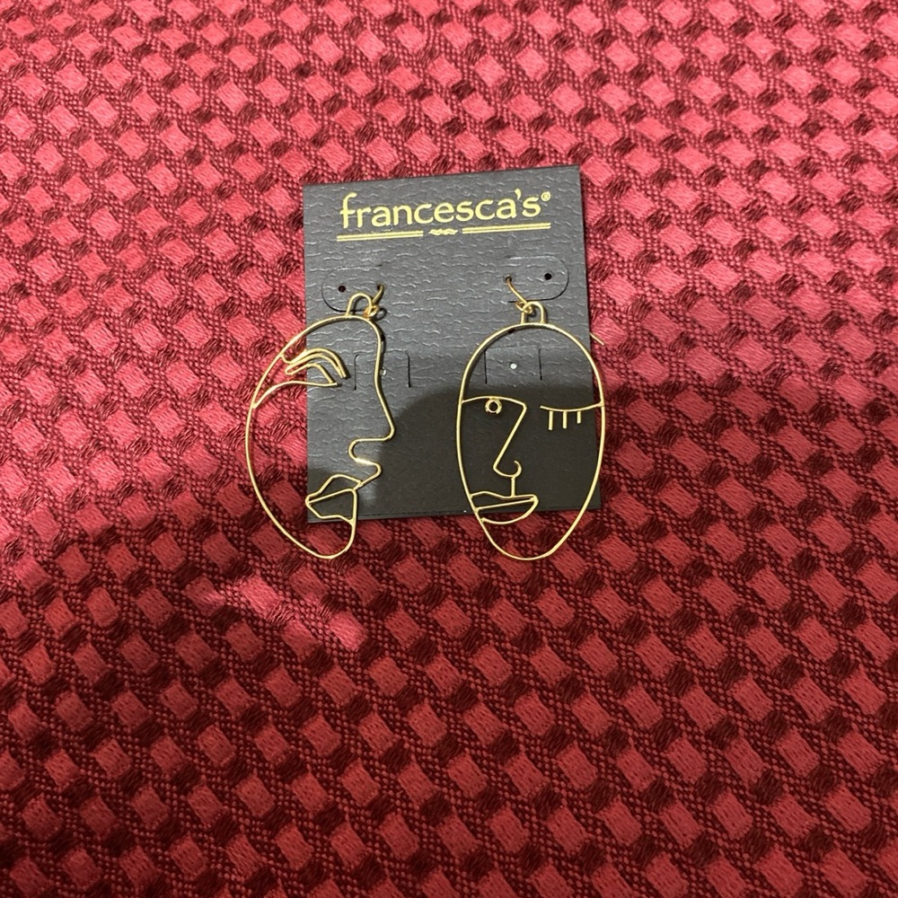 Francesca’s face earrings.